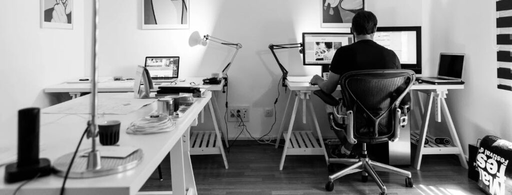 ergonomic chairs for the home office - man sitting on ergonomic chair
